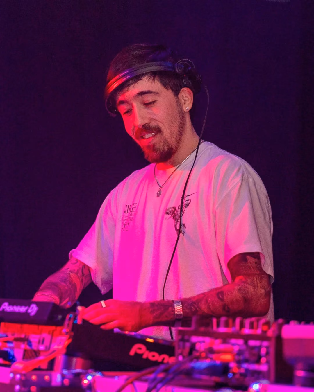 AED smiling behind the decks
