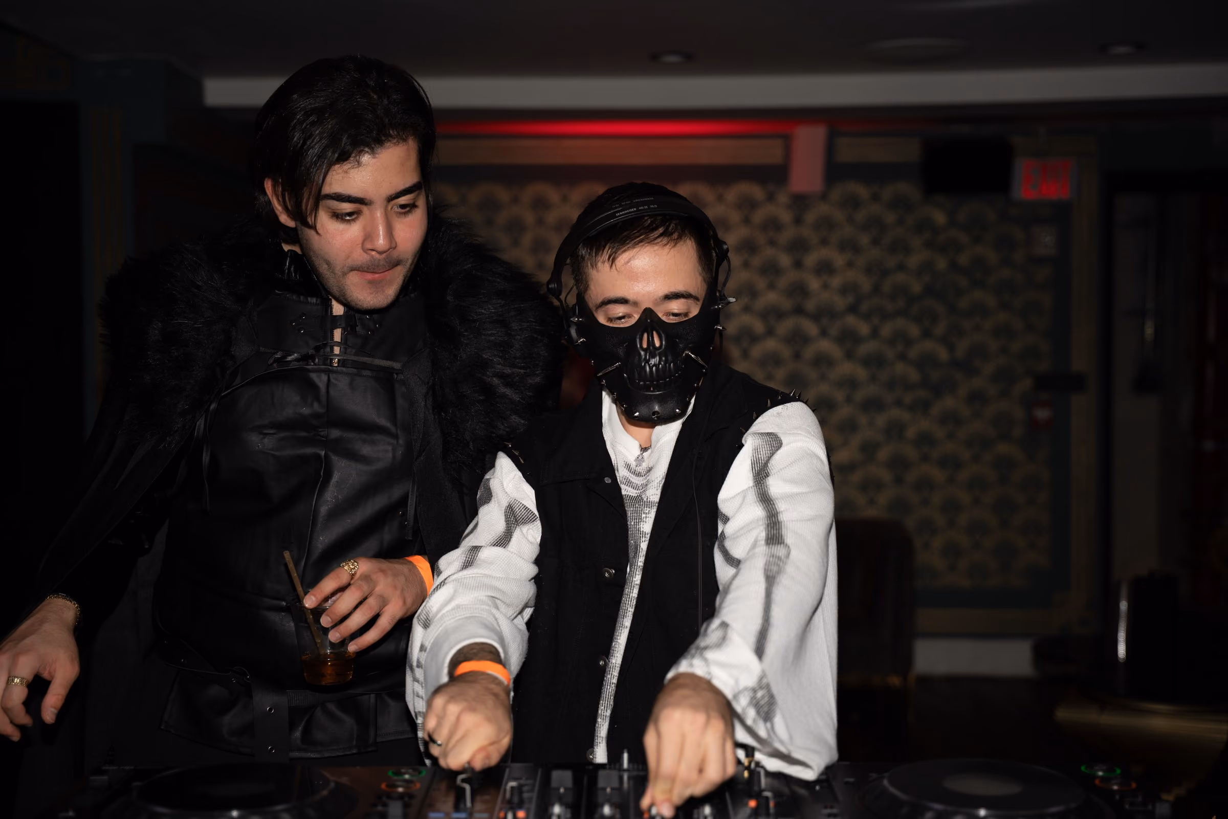 AED in a skull mask mixing at a Halloween night